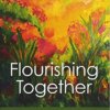 Book cover for "Flourishing Together: Guide to Appreciative Inquiry Coaching" by Miriam Subriana. The cover consists of a watercolored field filled with bright orange and red flowers.
